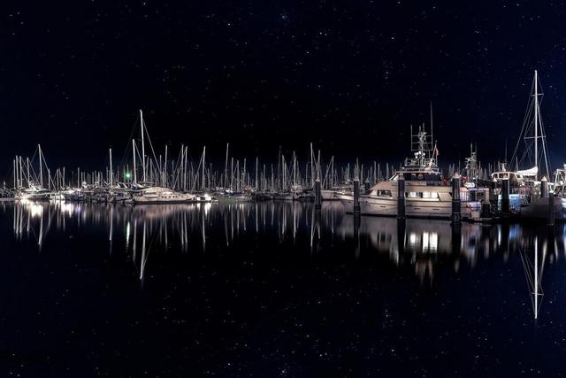 santa barbara boats at night with stary sky luxury print by Eddie Jongas
