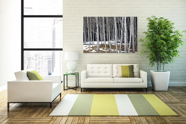 tree wall art display on brick wall as living room wall art with couch plant and window