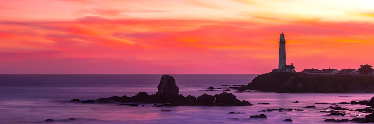 purple sunset by the lighthouse along california coast
