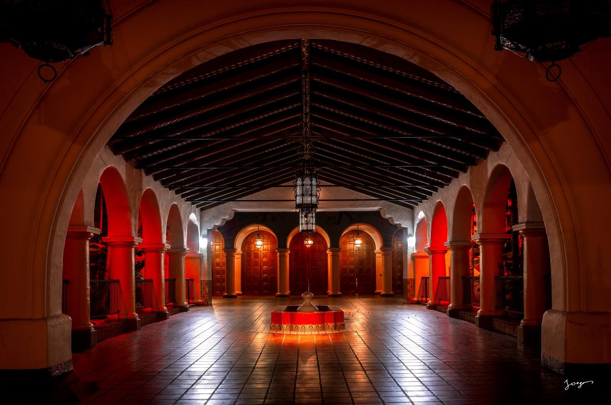 Symmetric hallway of a theater with an arch fine art by Eddie Jongas